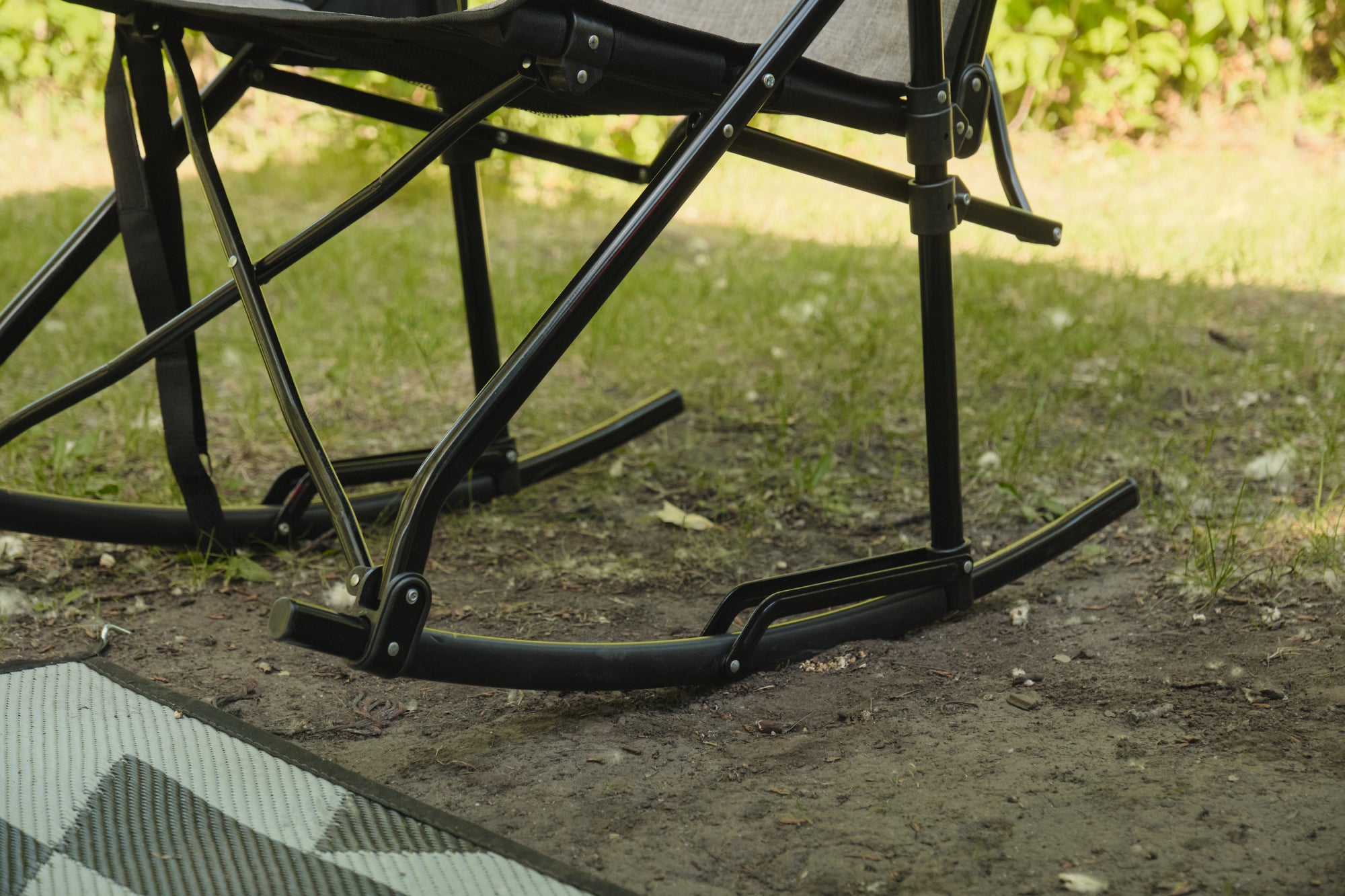 Kuma bear trax rocker outside with feet on ground