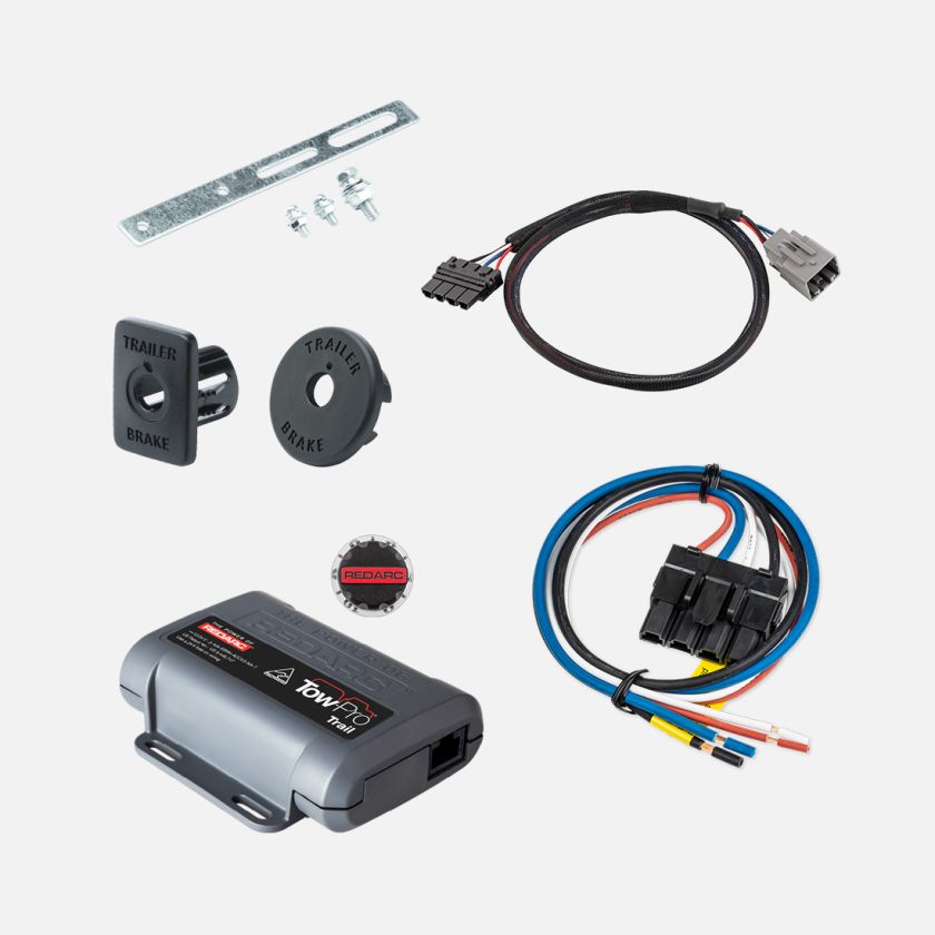 Collection of automotive parts including a wiring harness, brackets, and a control module on a white background.