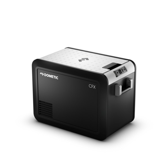 Dometic CFX3 45 electric cooler placed on a rocky backroad, showcasing its durable construction and portability with aluminum alloy carry handles.