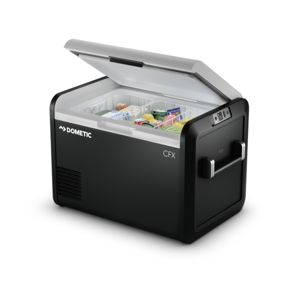 The Dometic CFX3 55IM, a tall portable electric cooler, featuring a sleek design with lightweight fender frames, strong aluminum alloy handles, and a high-resolution color display. The cooler is shown on a rugged outdoor background, highlighting its durability and portability