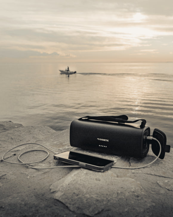 The Dometic PLB15 battery showing its 5 LED indicators lit up, displaying the current charge level