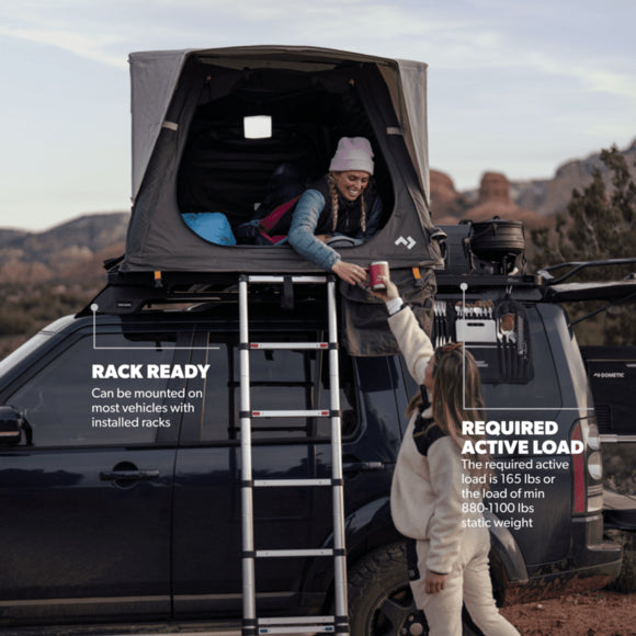 A side perspective showing the Dometic TRT 140 AIR rooftop tent mounted on a vehicle roof, highlighting its durable 300D Ripstop Polyester material, tri-fold design, and sleek appearance.