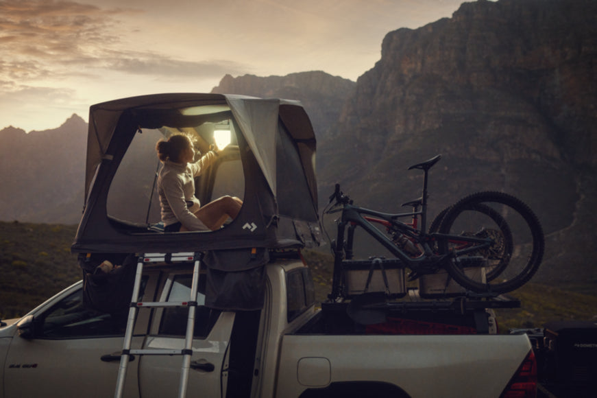 A close-up of the tent's breathable mesh windows and zippered blinds, designed to reduce condensation, provide privacy, and keep insects out.