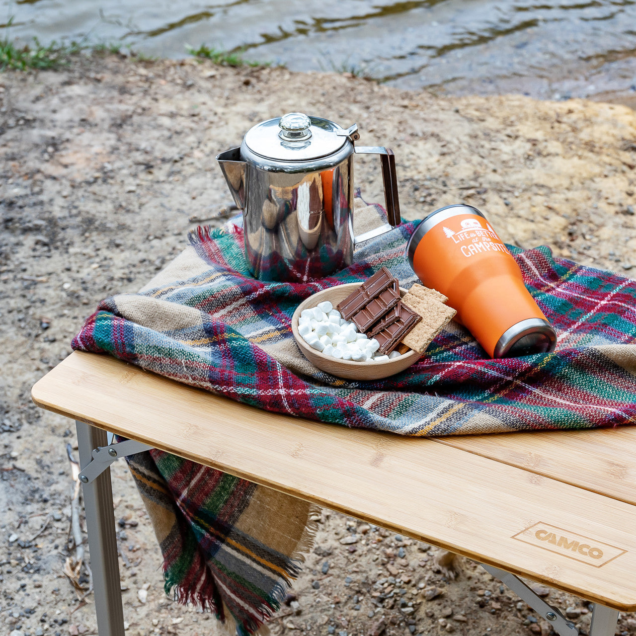 Portable bamboo tabletop with aluminum folding legs and compact storage design