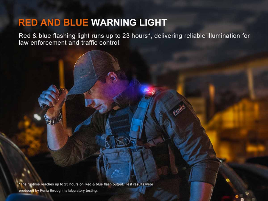 A man in tactical gear wearing a cap and vest stands outdoors at night with a red and blue warning light attached to his cap and vest, with text overlay describing the light's 23-hour runtime and use for law enforcement.