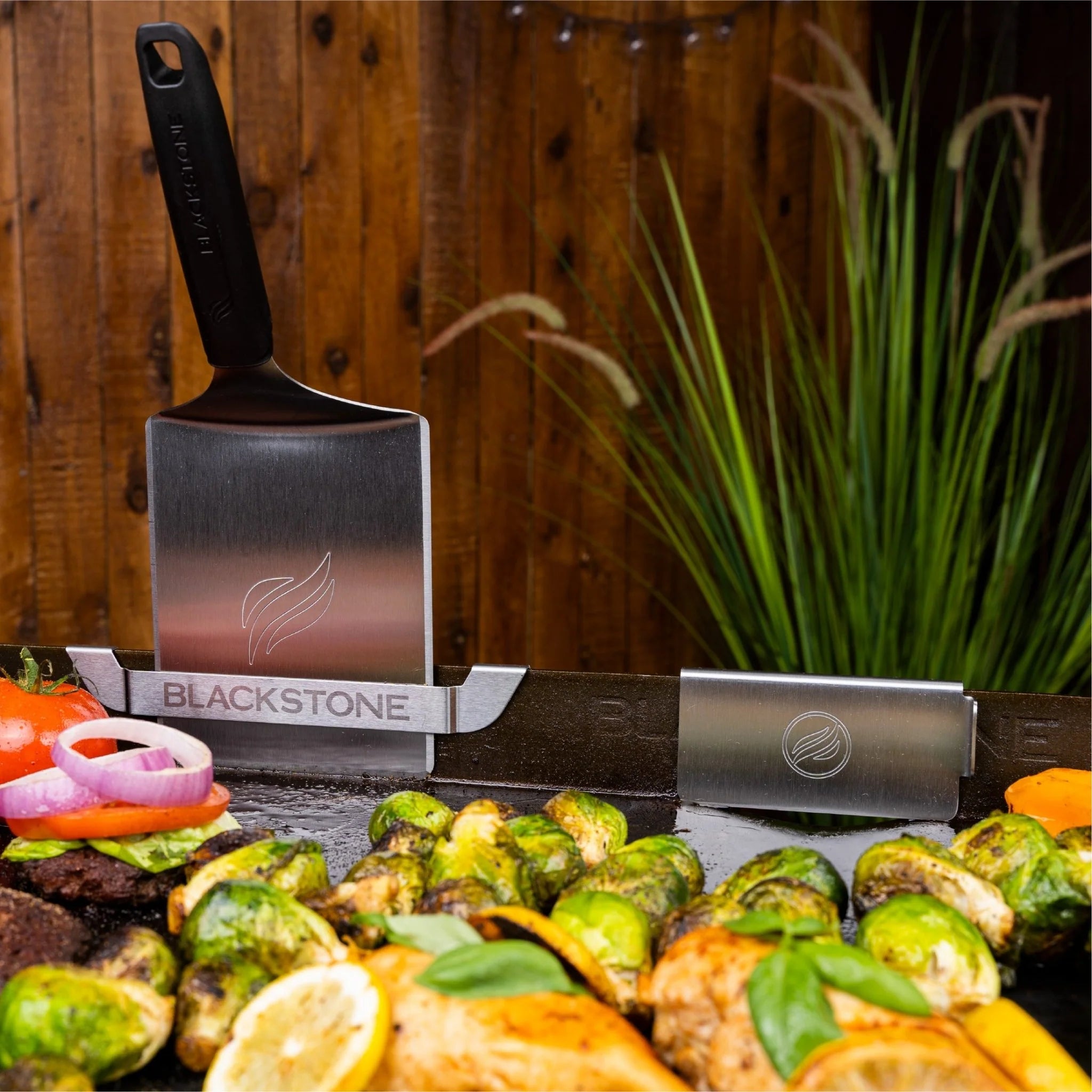 Blackstone griddle cooking accessory set with grease guard and utensil holder
