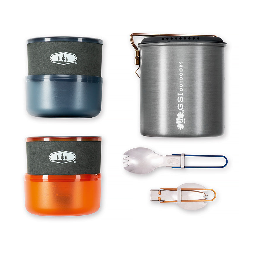 Two-person cookware set including a 1.4L pot, strainer lid, mugs, bowls, sip-it tops, folding sporks, and welded sink