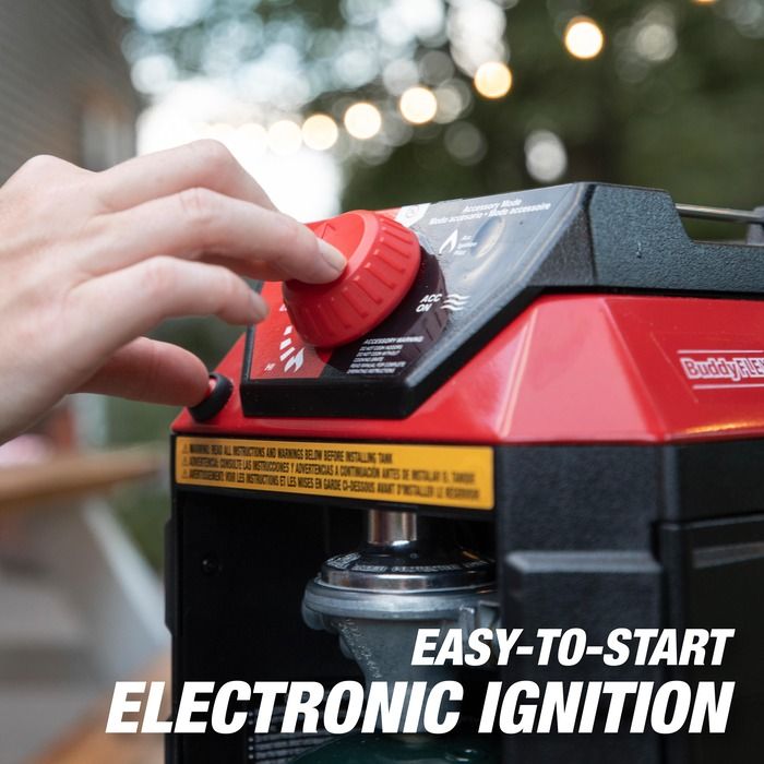 Hand operating a red and black ignition switch with 'Buddy Rice' branding, outdoors.