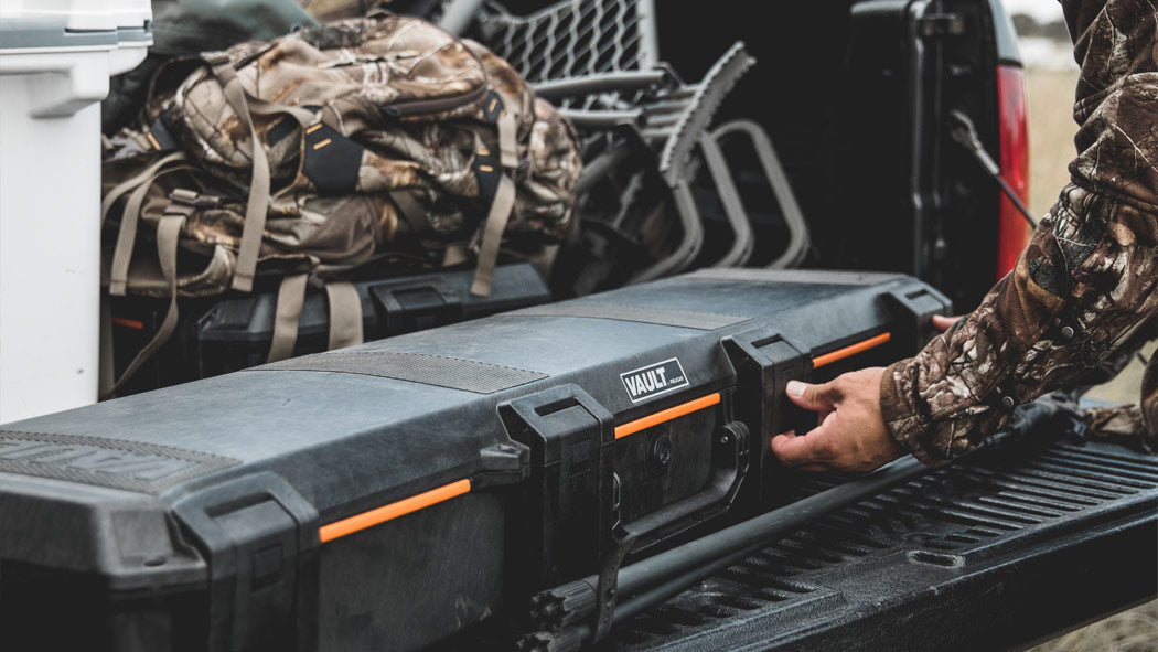 Vault series gun case shown with measurements of 50 x 10 x 6 inches interior, and 51.47 x 13.15 x 6.65 inches exterior, crafted from high-impact polymer with ABS latches, stainless steel pins, and polyurethane foam