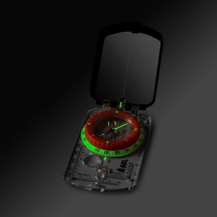 Hiking compass with extended base plate and magnifier