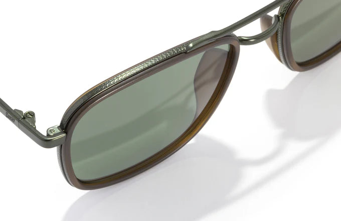 A front view of the Estero sunglasses in a square aviator shape, showcasing polarized lenses in a range of colors that provide superior clarity and UV protection. The 53mm lens width and medium wrap angle give a comfortable, stylish fit