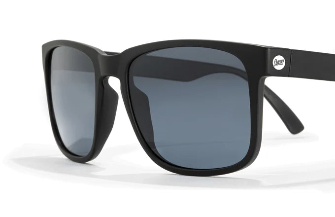 Close-up of the polarized lenses, available in amber and midnight blue tints, offering higher contrast optics and full UVA/UVB protection. Both options have a non-mirrored finish with a 15% visible light transmission (VLT) for enhanced clarity.