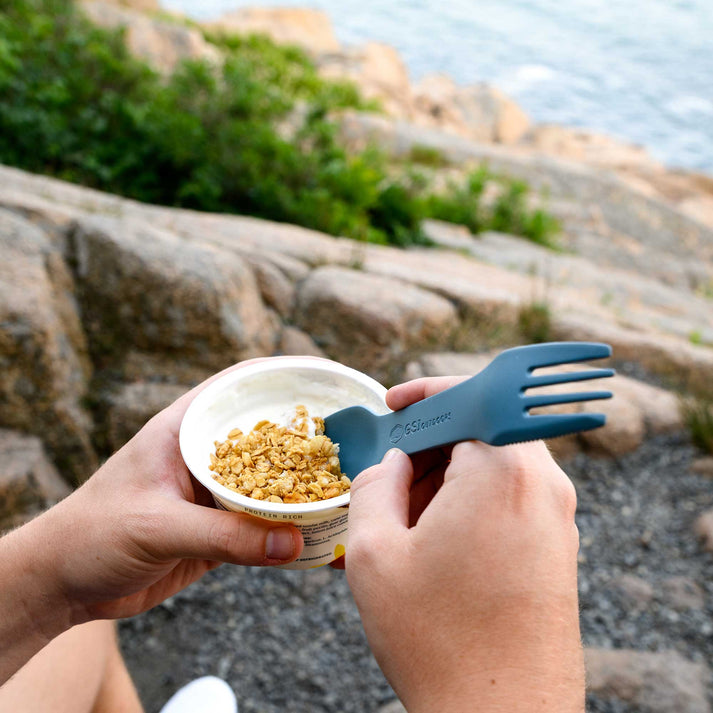 Close-up of the spoon in the utensil set, showcasing its smooth, ergonomic design for easy scooping and eating