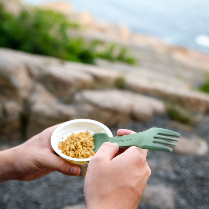 Detailed view of the multi-function fork with a serrated cutting edge, designed for both eating and light cutting tasks