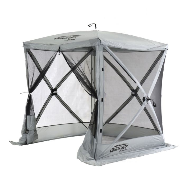 Green Clam Quick-Set Traveler gazebo with mesh sides and stakes in grass