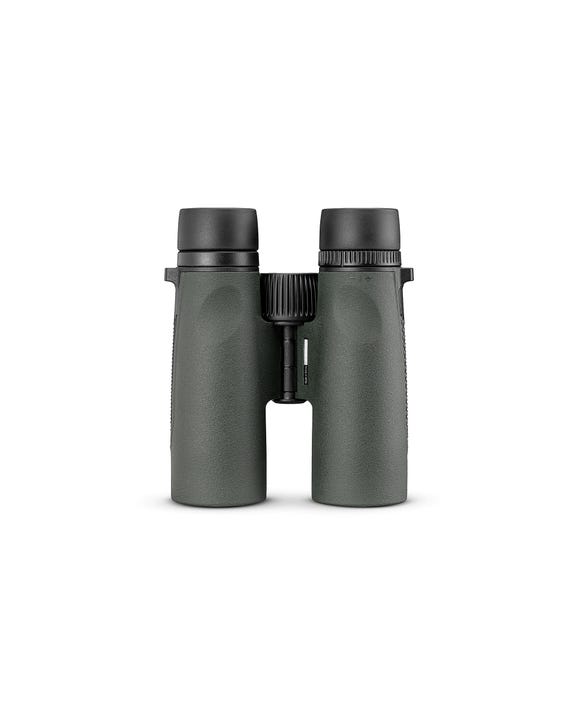 Hunter using Triumph HD 10x42 binoculars for wildlife observation in wooded terrain