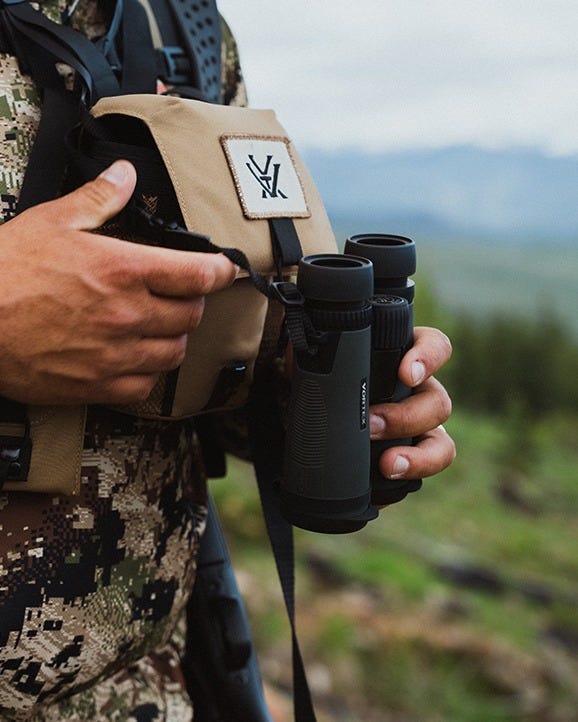 Close-up of Diamondback HD 10x42 binoculars showing focus wheel and adjustable eyecups