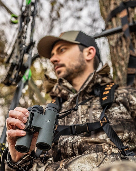 "Close-up of Triumph HD 10x28 binoculars showing focus wheel and eyecups