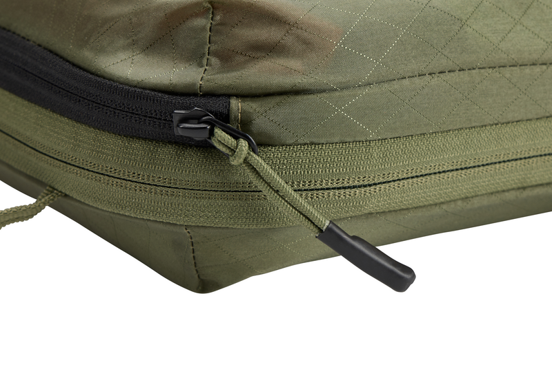 Thule Packing Cube with semitransparent fabric, showing the interior contents while maintaining discretion.