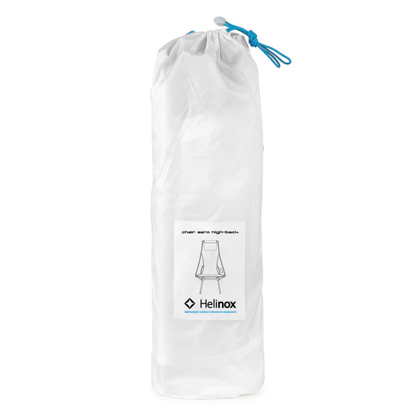 Chair One set up in a scenic camping location, demonstrating its portability and comfort for outdoor activities like hiking or beach trips.