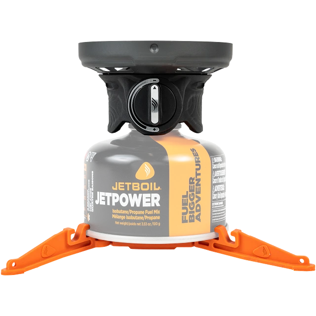 The Jetboil Zip 0.8L cooking system neatly packed inside its cooking cup, with the bottom cover doubling as a measuring cup and bowl. The fuel canister and burner fit compactly inside for easy storage.

