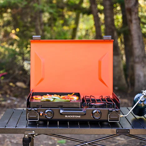 Blackstone 14-inch griddle with side burner for cooking meals and heating liquids outdoors