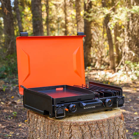 Lightweight tabletop griddle with adjustable feet and push-button ignition