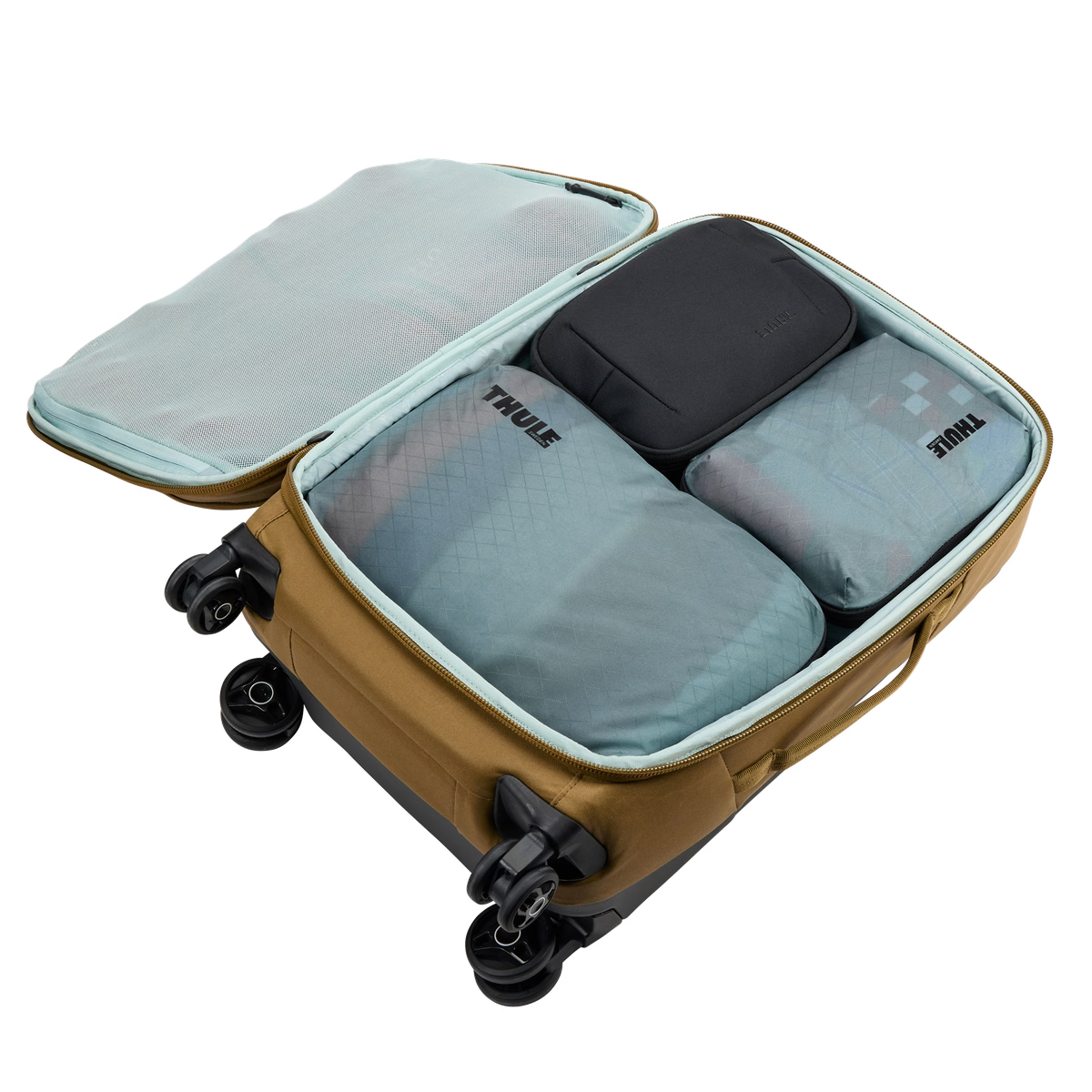 Thule Compression Packing Cube Showing Clothes and Travel Gear Inside