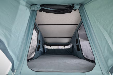 Thule Widesky rooftop tent showing spacious front headroom and seating area