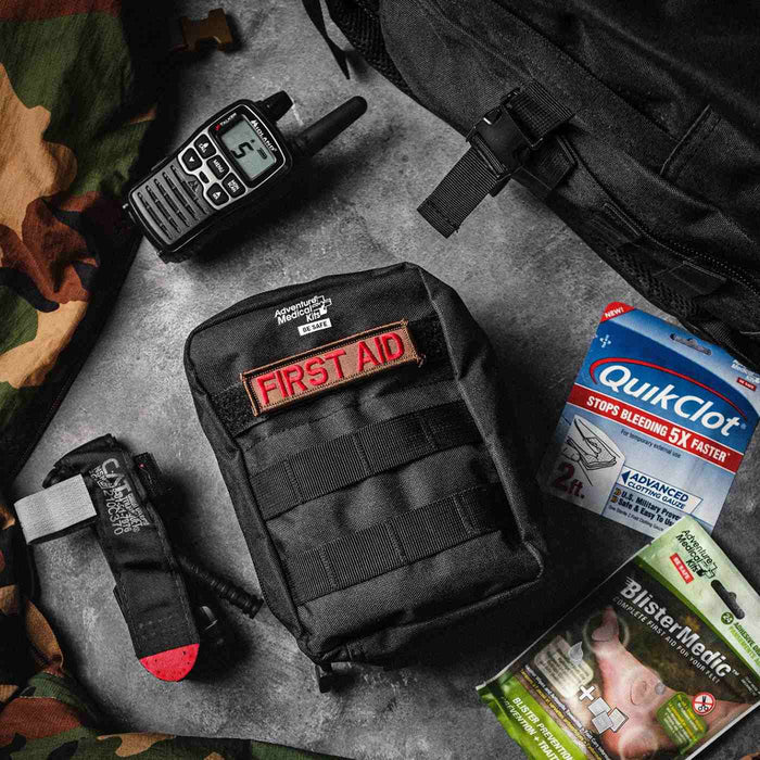 Comprehensive wilderness first aid kit with QuikClot and trauma supplies