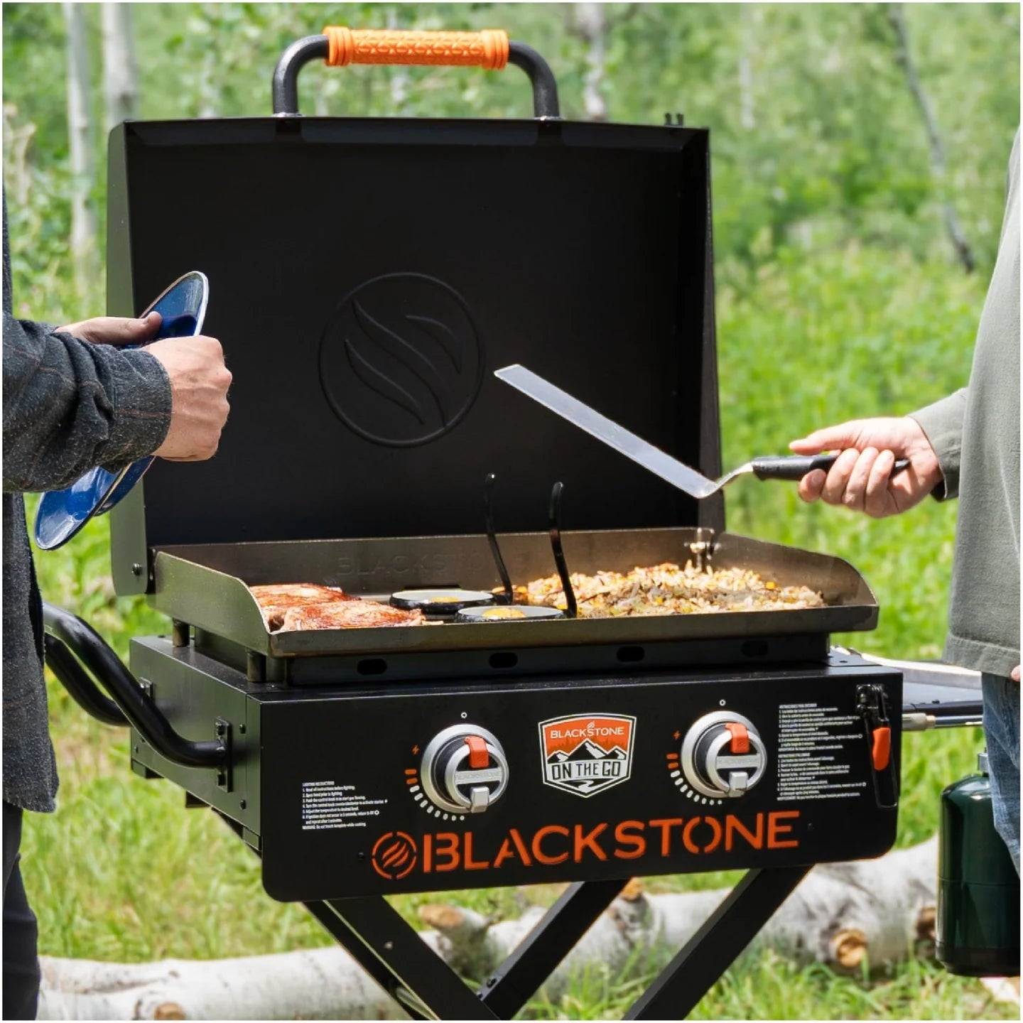 Portable Blackstone propane griddle with Flexfold legs and side shelf handle
