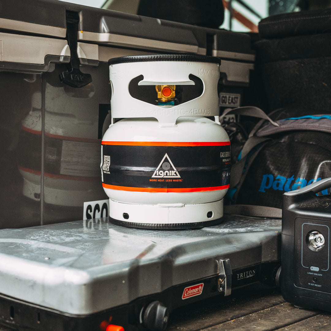 Compact and portable Gas Growler 3.8 propane tank, perfect for camping, tailgating, and outdoor adventures.