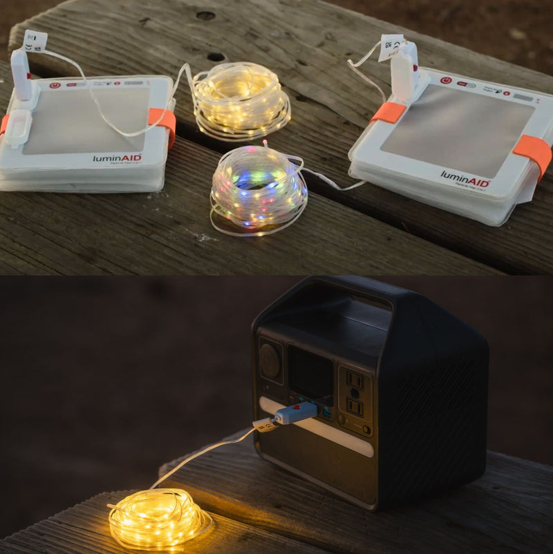 Multi-color USB string lights lighting up a backyard or campsite.