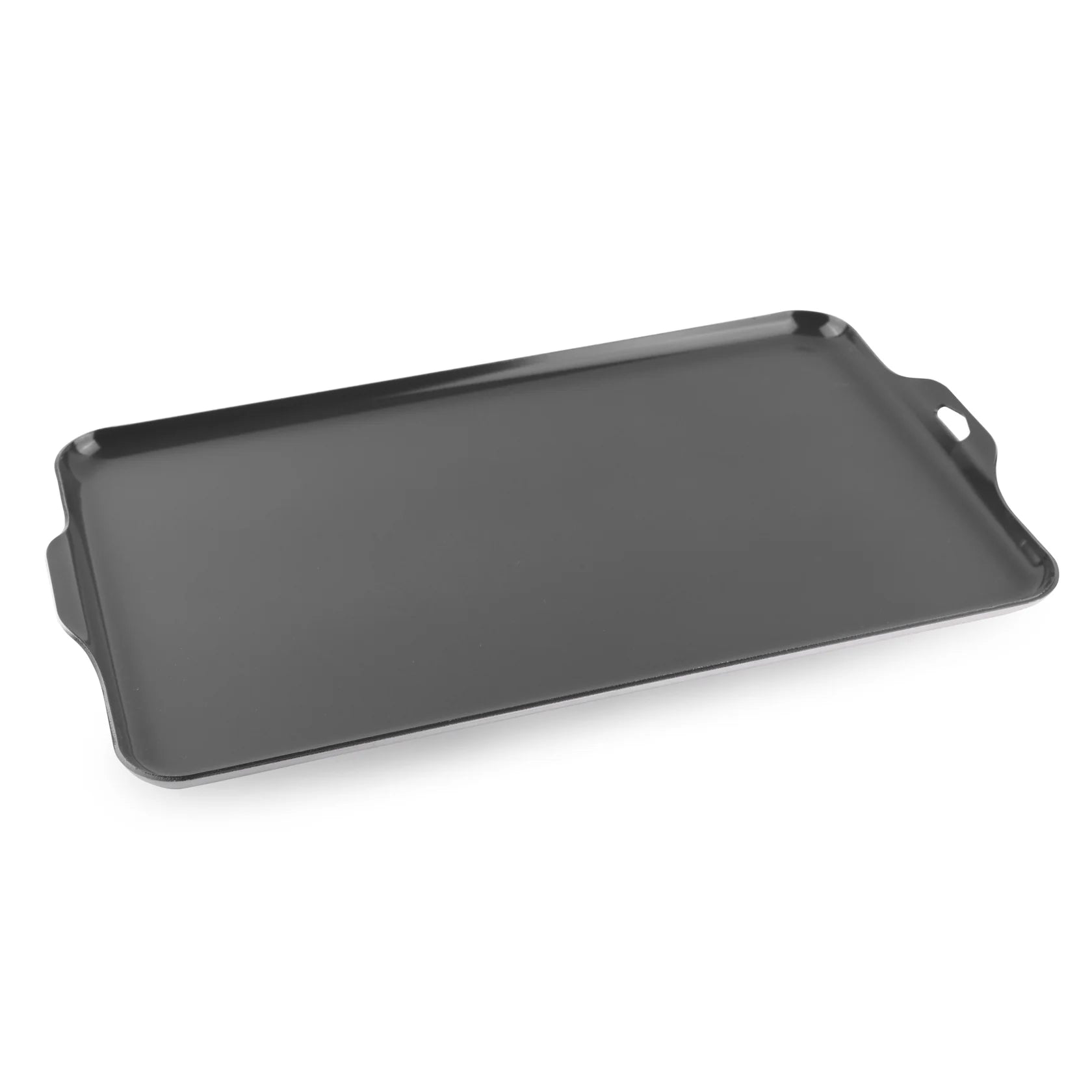 Heavy-gauge aluminum camping griddle with ceramic non-stick surface cooking bacon, eggs, and pancakes on a two-burner camp stove