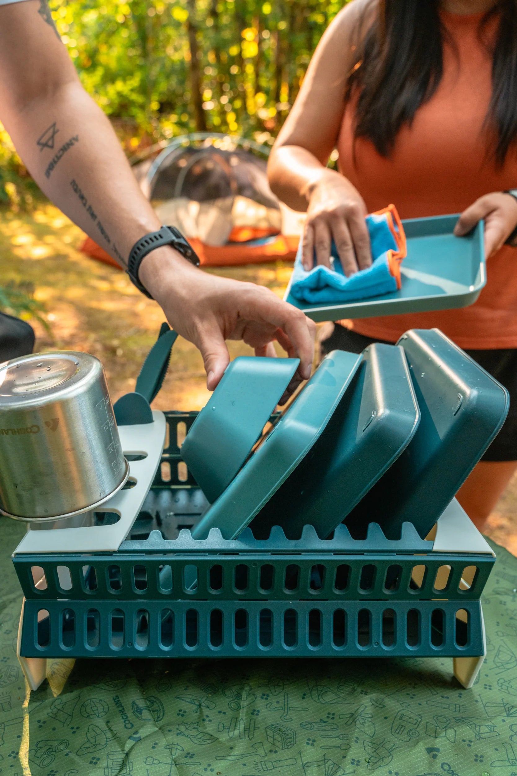 Camping dish rack with secure glassware fingers and drain spouts, durable portable organizer for outdoor cleanup