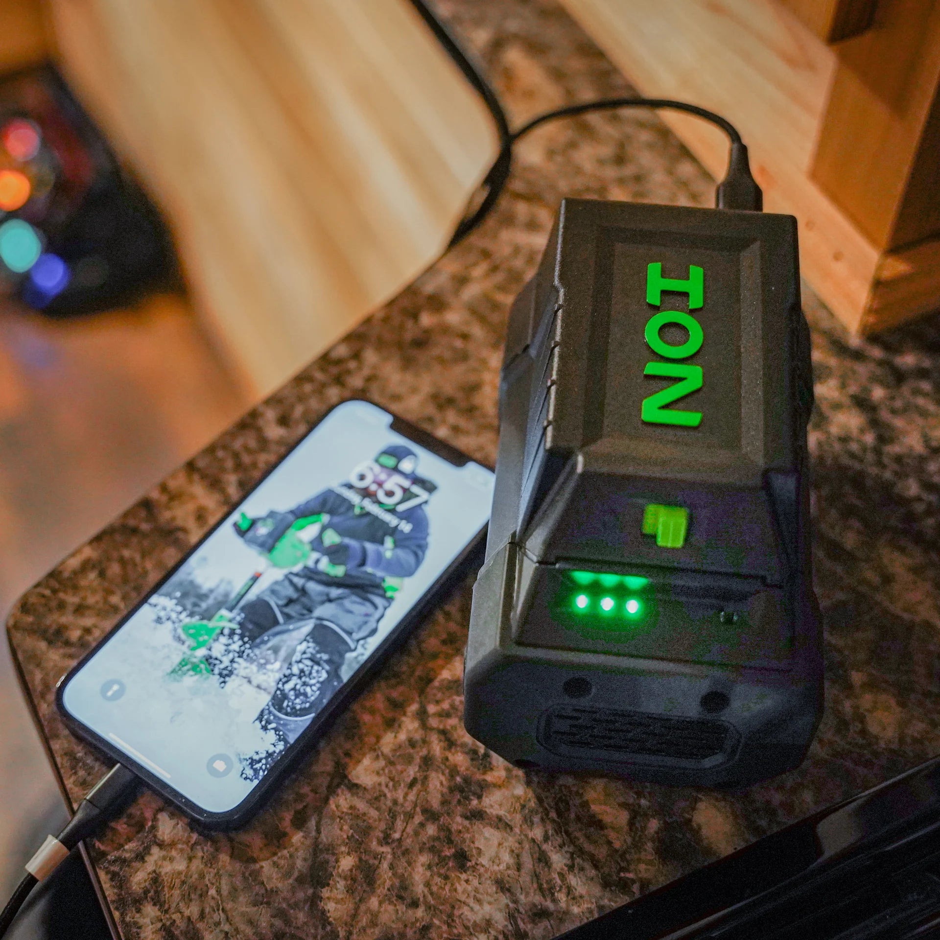 Dual-purpose ION battery adapter converting 40V battery to USB and 12V power