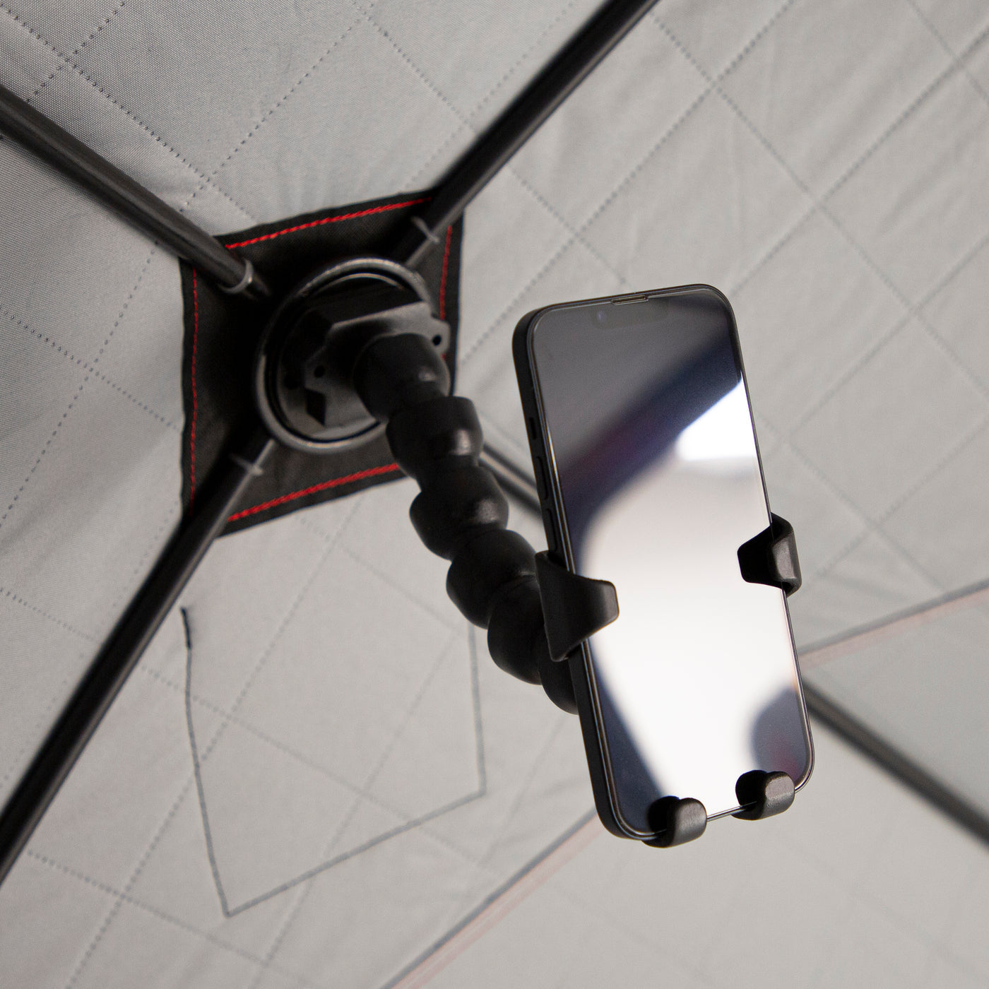 Adjustable, flexible arm of the E-Hub™ Phone Holder bent in a custom position to hold a phone steady