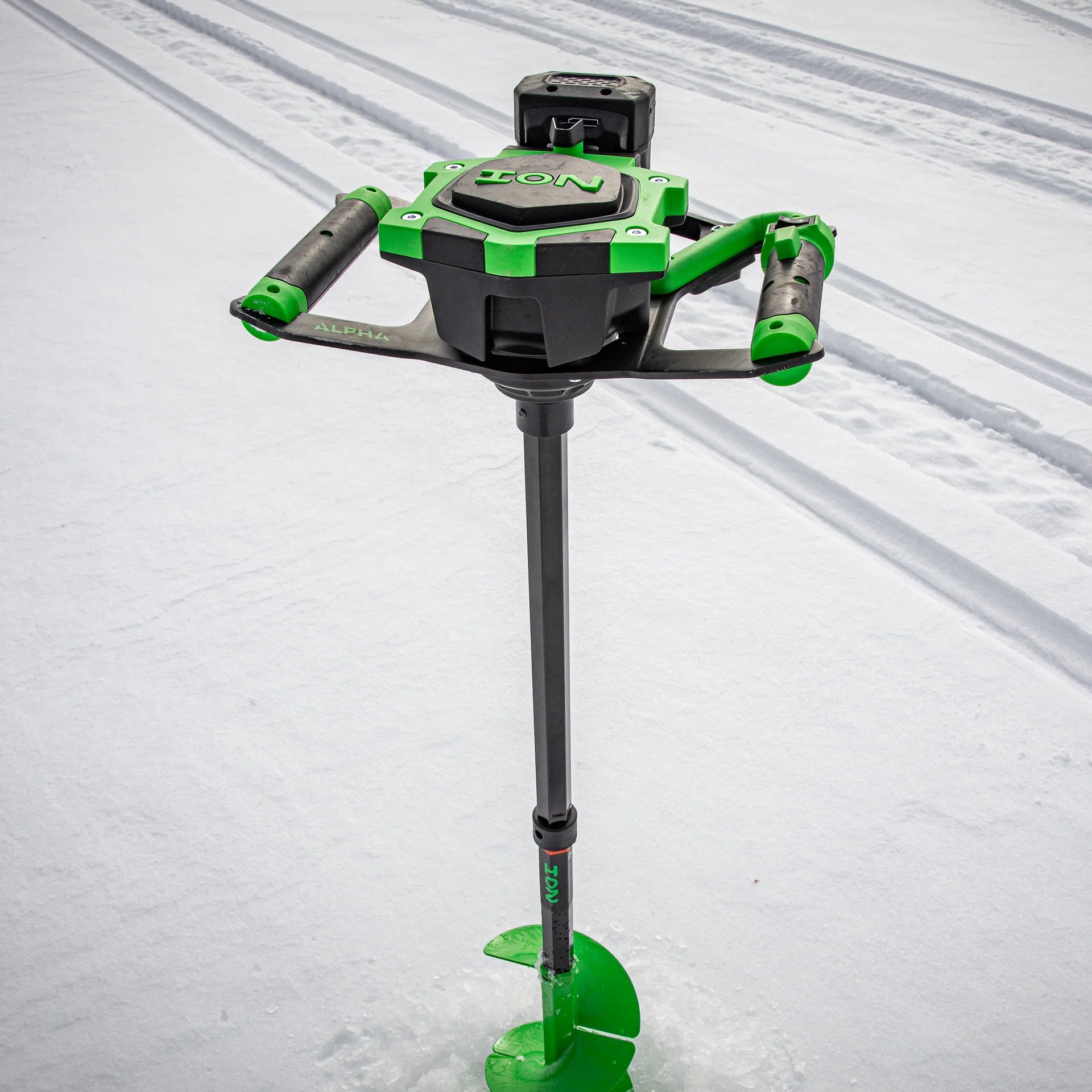 Green and black ice auger on a white background