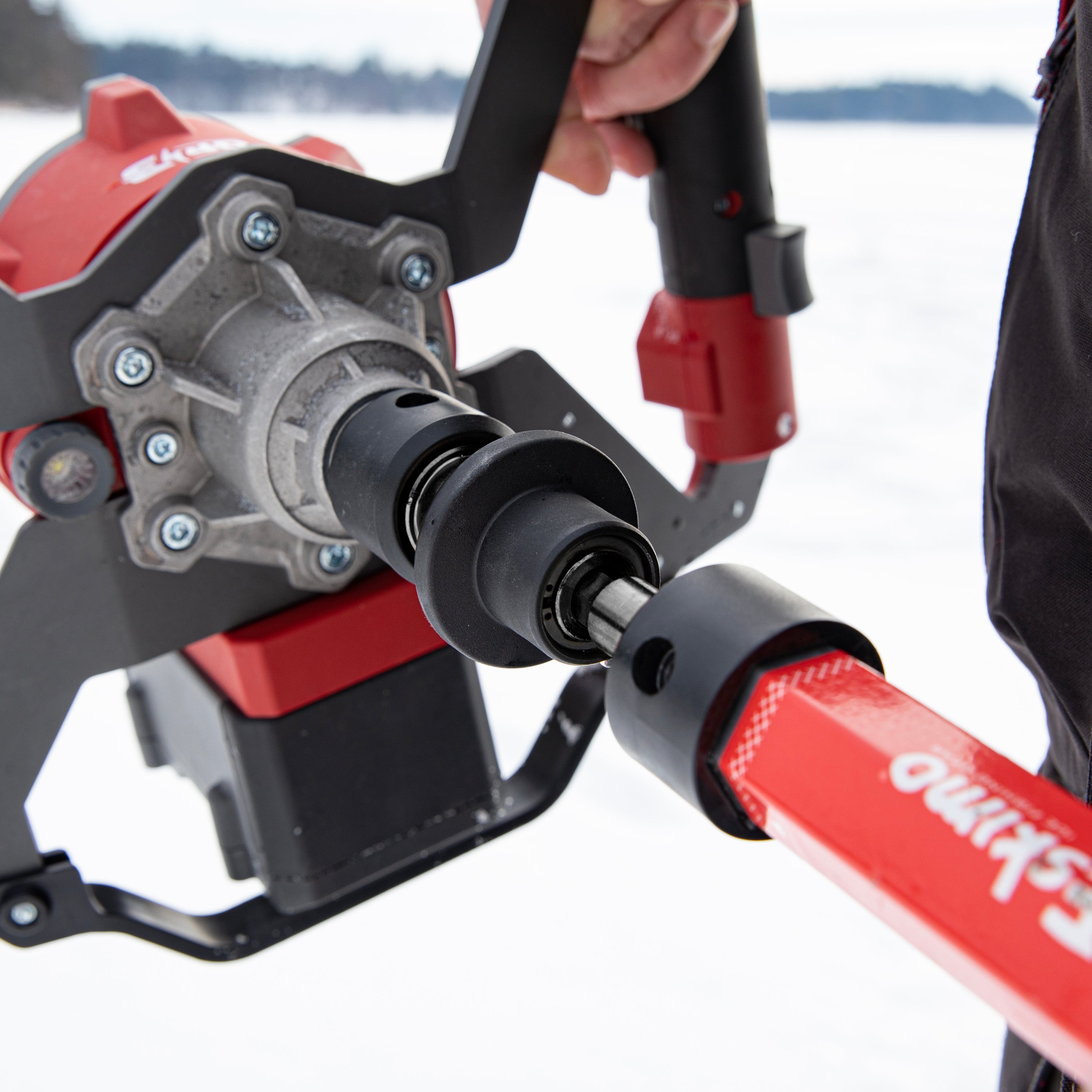 Demonstration of Eskimo Quick Connect Kit swapping auger bits without tools using impact-style release system