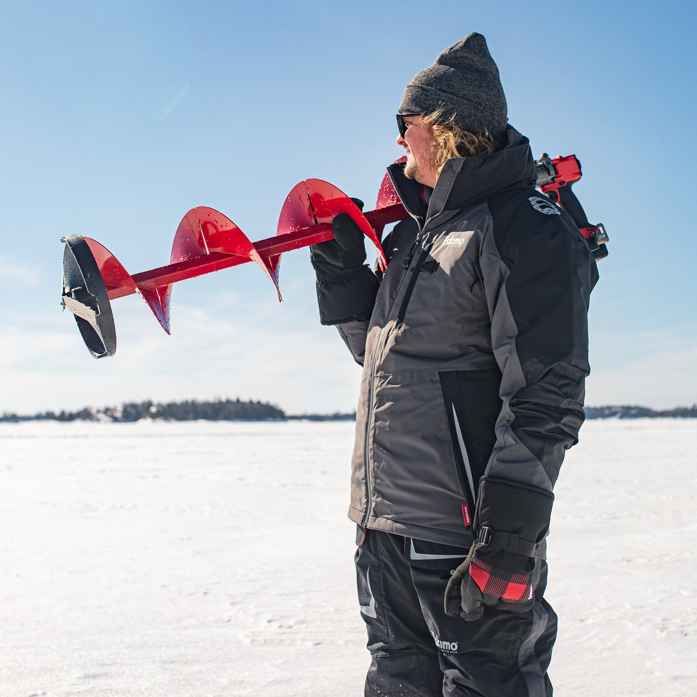 Lightweight ice auger weighing under 5 lbs, designed for efficient hole hopping.