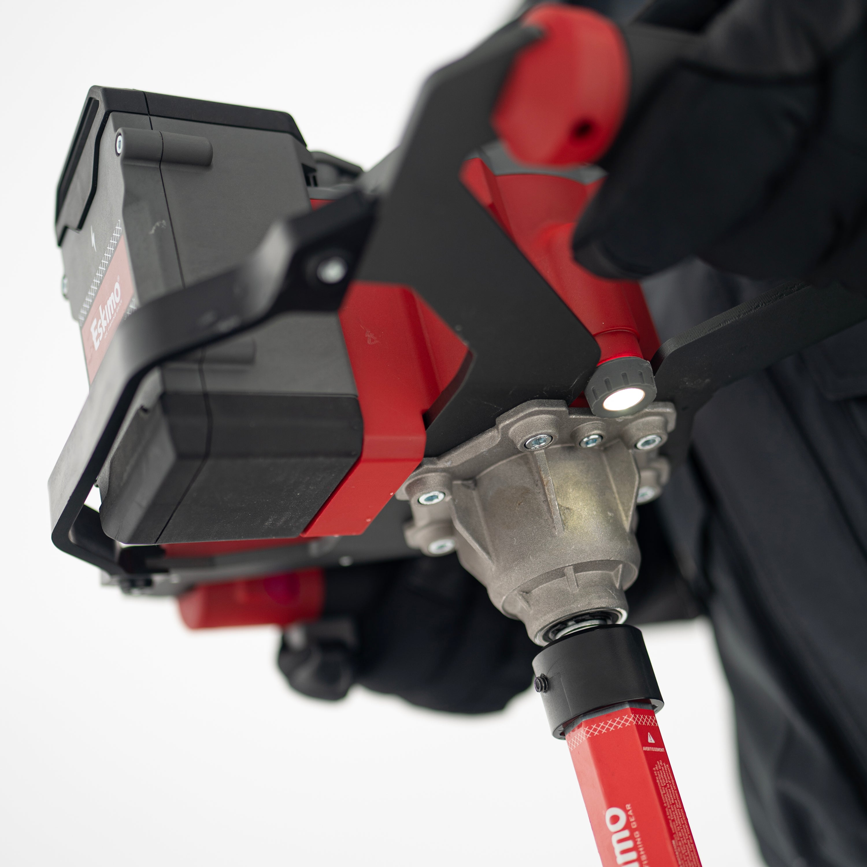 Variable speed trigger on E40 8-inch electric ice auger for precise control and clean hole cutting