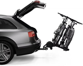 Thule T2 Pro XTR bike rack being easily installed on a vehicle using the tool-free AutoAttach system