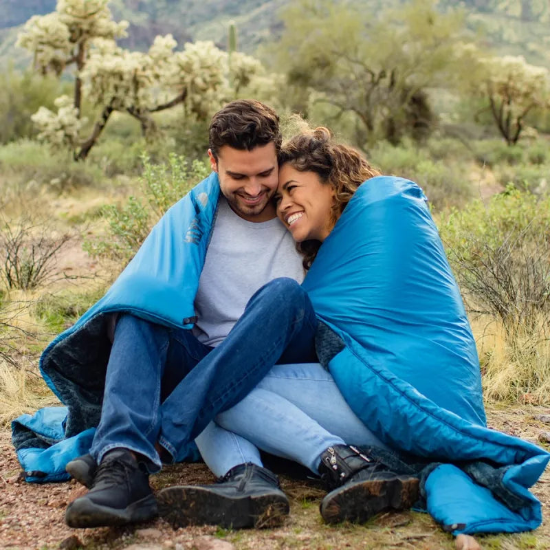 Versa Luxe Blanket folded into a compact pillow, showcasing its versatility for easy storage and travel.