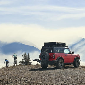 Integrated cable lock and lock knobs on the Thule T2 Pro XTR bike rack, providing security by locking bikes to the rack and the rack to the vehicle.