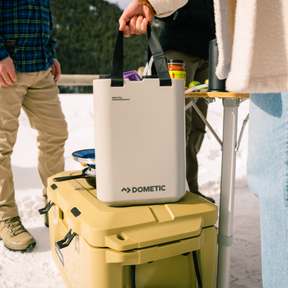 Dometic HYD J11 Water Jug connected to the Hydration Water Faucet, demonstrating its quick-connect CPC fitting.