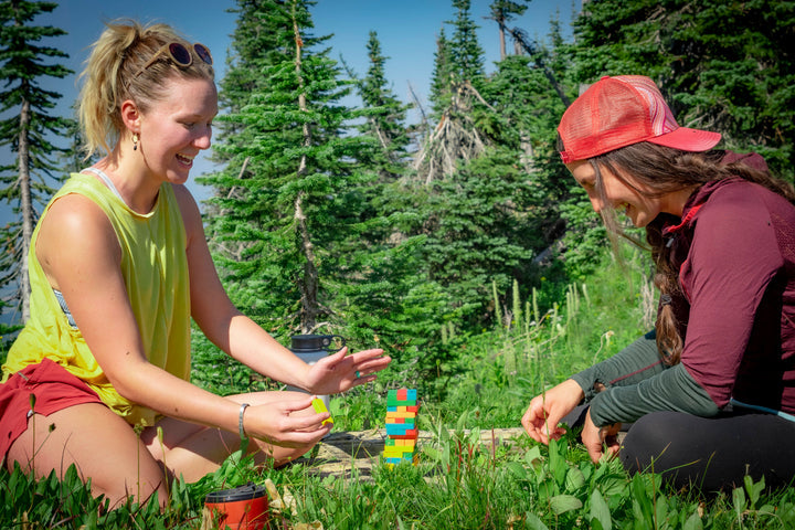 Players removing blocks in a stacking game of skill and balance