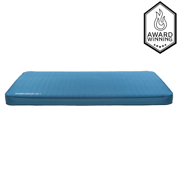Luxury camping mattress with self-inflating foam core and soft stretch fabric top