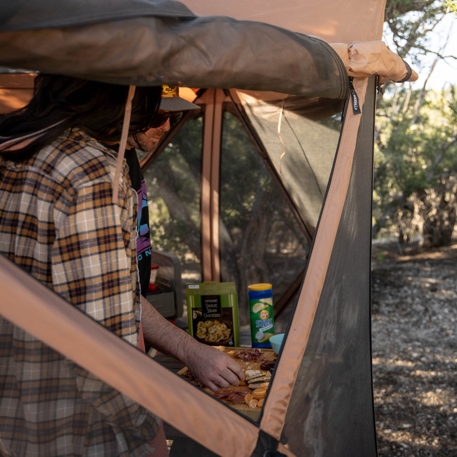 Gazelle G6 Cool Top GG620BR gazebo in Badlands Brown set up in a sunny campground with six-sided mesh panels for ventilation