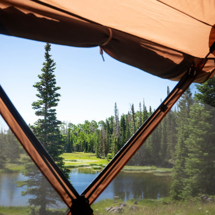 Large hexagonal Gazelle G6 Cool Top GG620BR gazebo offering bug-free shelter for up to 8 people outdoors.