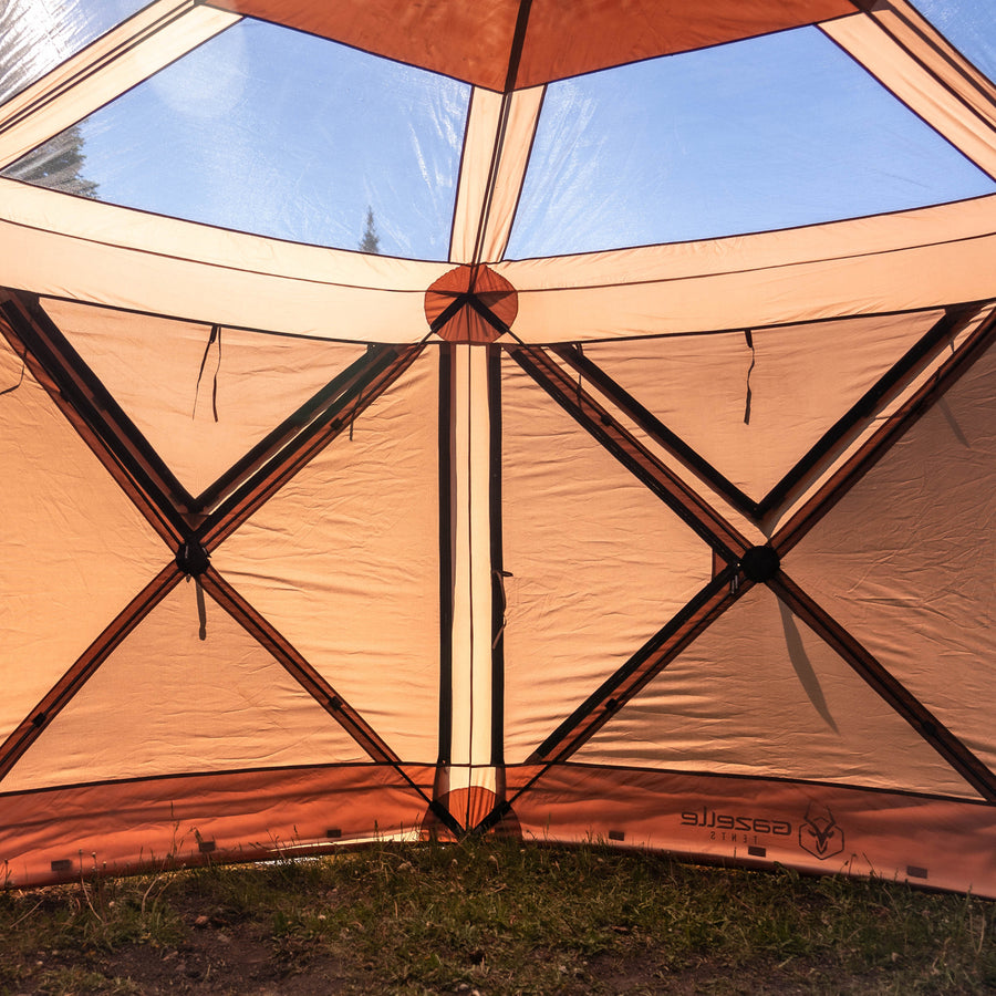 Gazelle GG620BR G6 Cool Top gazebo in scenic mountain campsite with mesh walls and brown weatherproof canopy